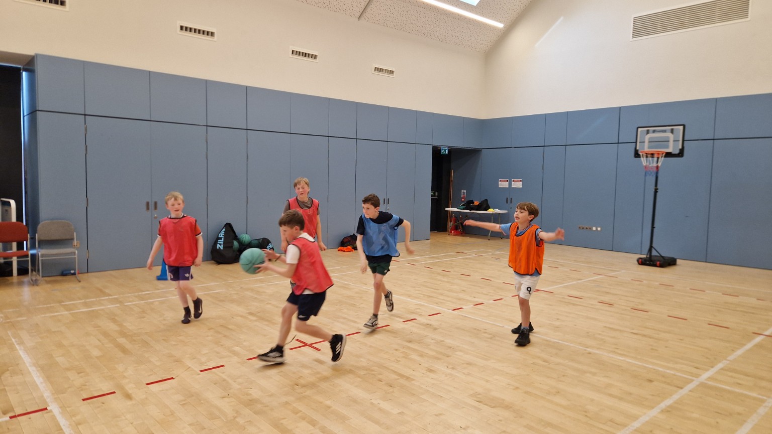 Young basketball players attacking and defending in a game-based activity